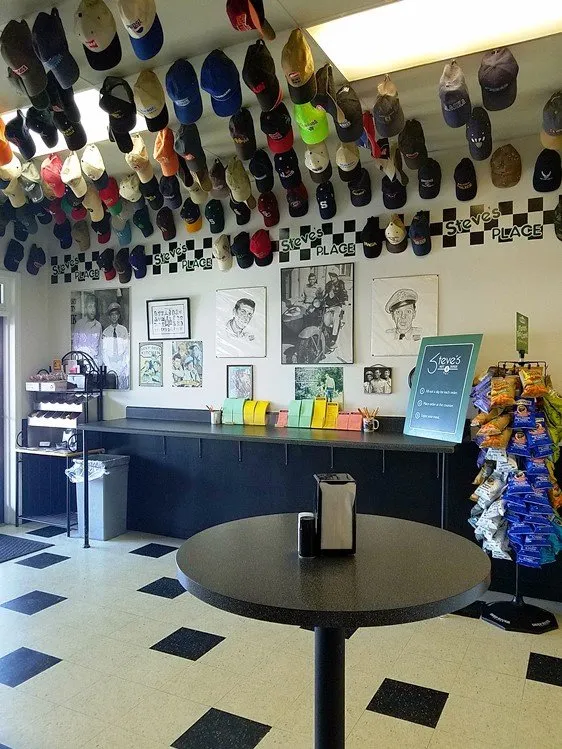 Order form area and ceiling covered with hats at Steve's Place in Raleigh - NC Triangle Dining