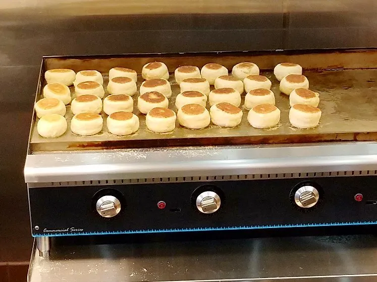 Muffins on the griddle at Michael's English Muffins in Raleigh - nctriangledining.com