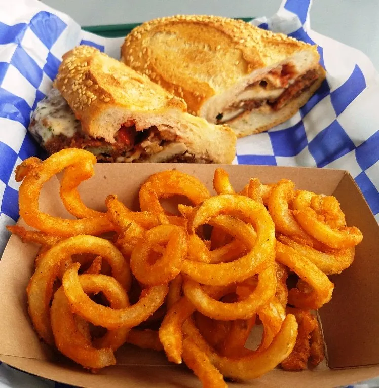 Chicken parm sandwich with curly fries at Eastcut Sandwich Bar in Durham - nctriangledining.com