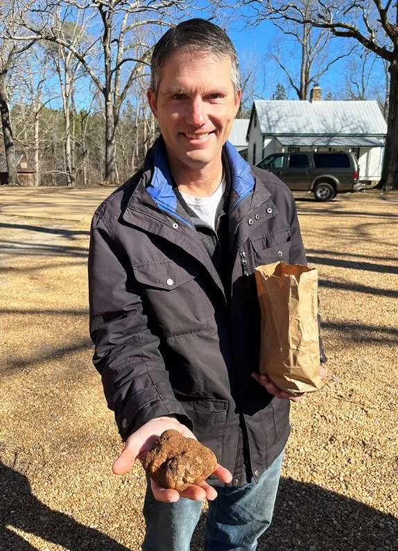 Showing off a large bianchetto truffle at Burwell Farms - nctriangledining.com