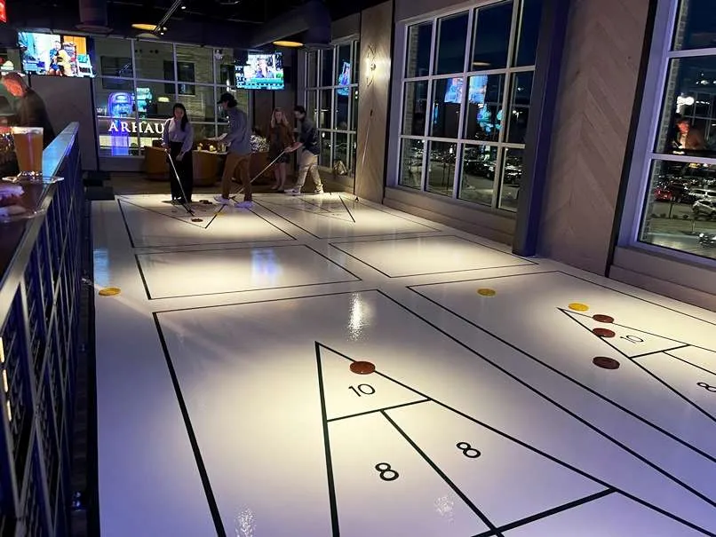 2nd floor shuffleboard at Sports & Social at Fenton in Cary - nctriangledining.com